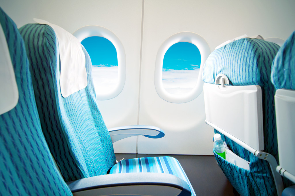 Empty aircraft seats and windows.