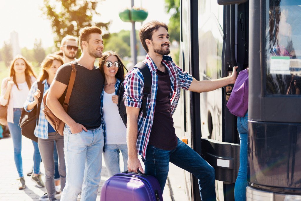 people boarding a bus