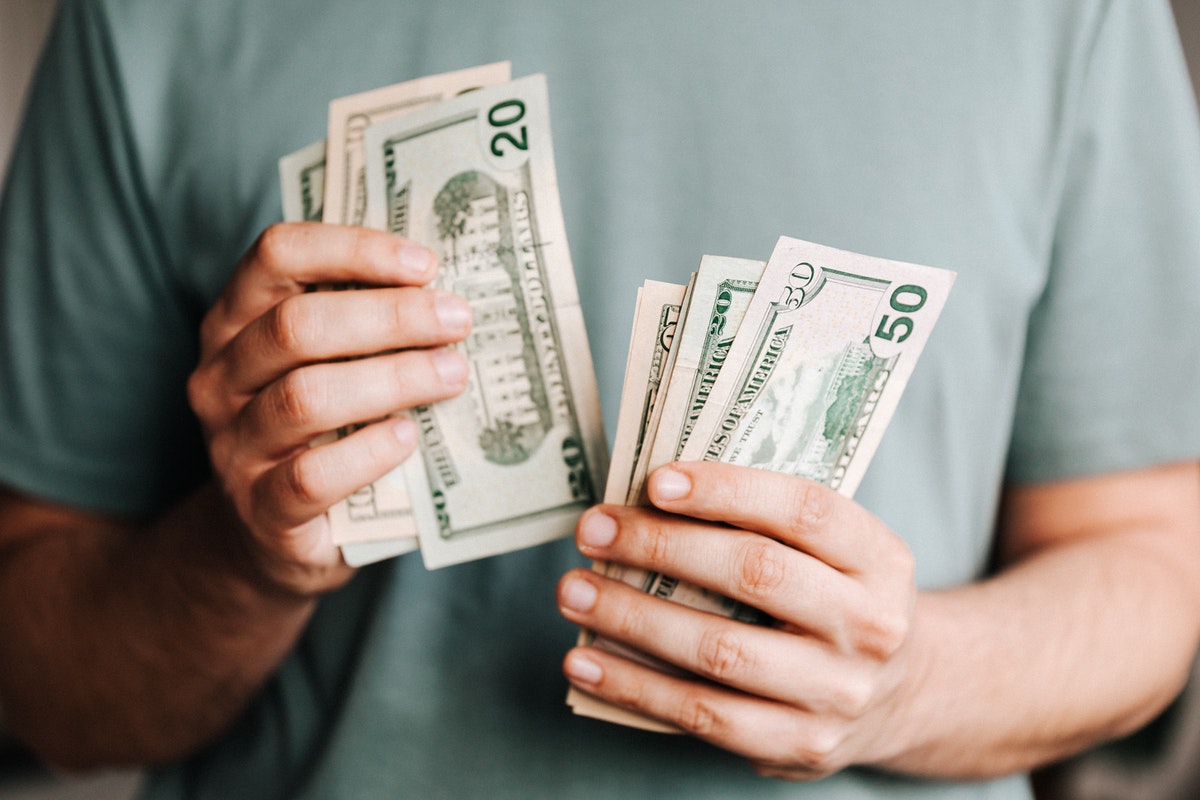 man counting his money