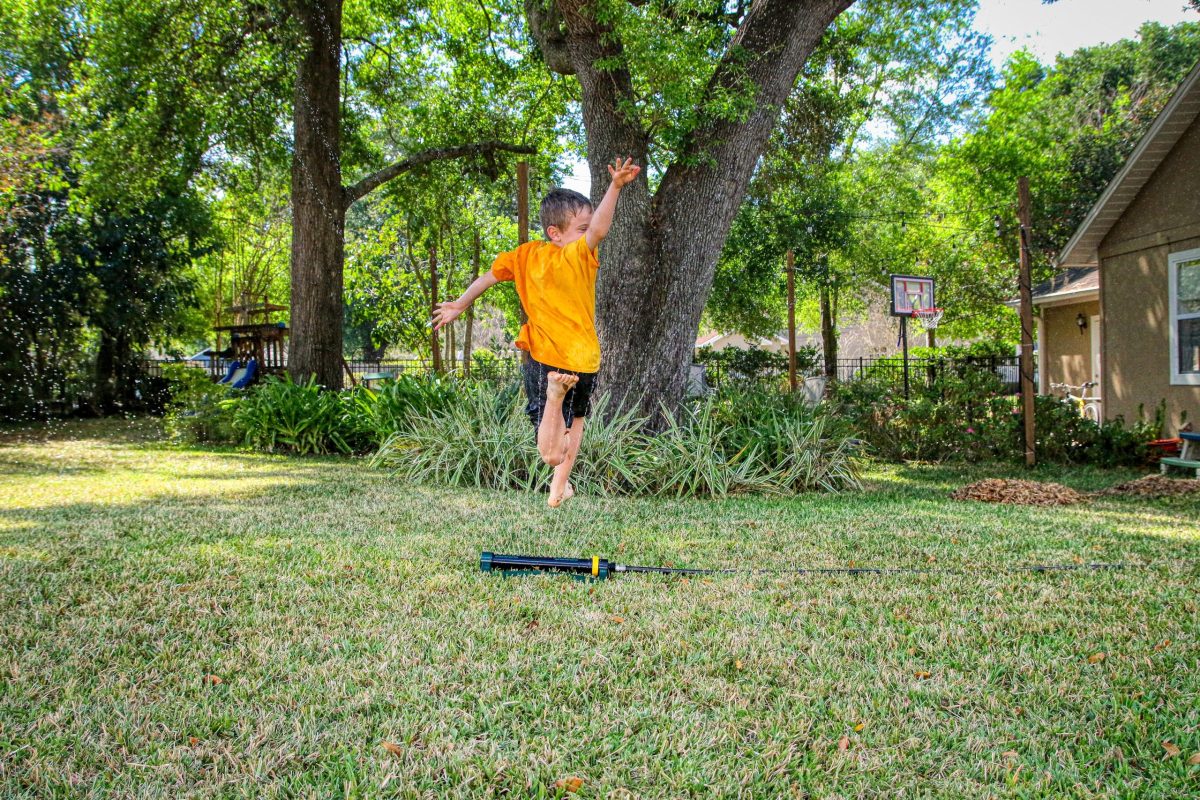 kid having fun in backyard