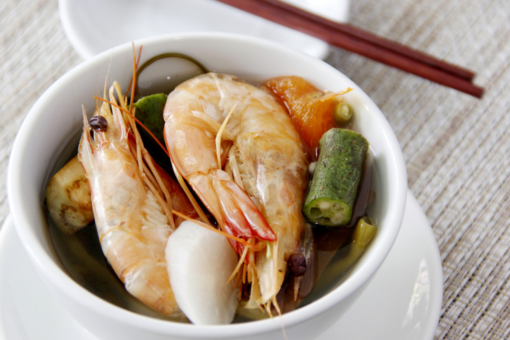 a tamarind soup base called sinigang with shrimp and assorted vegetables