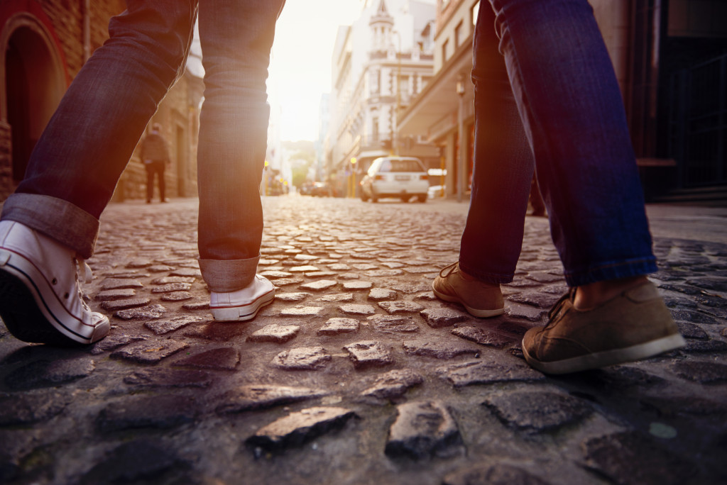 Focus on feet walking through city streets